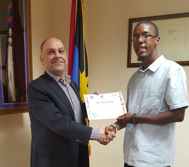 Minister of Energy the Hon. Asot Michael awards Toure Forde 1
